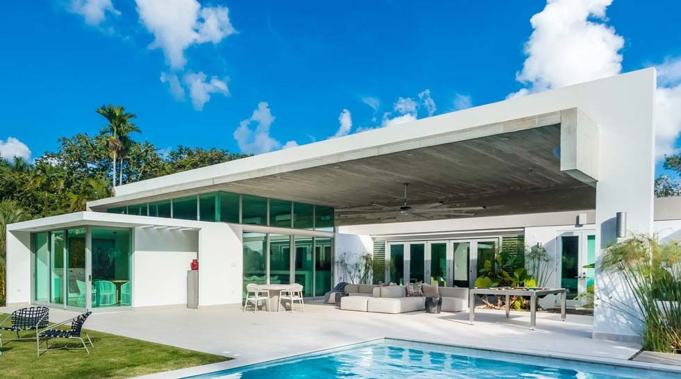 Air Master impact windows and sliding doors on a poolside Caribbean home