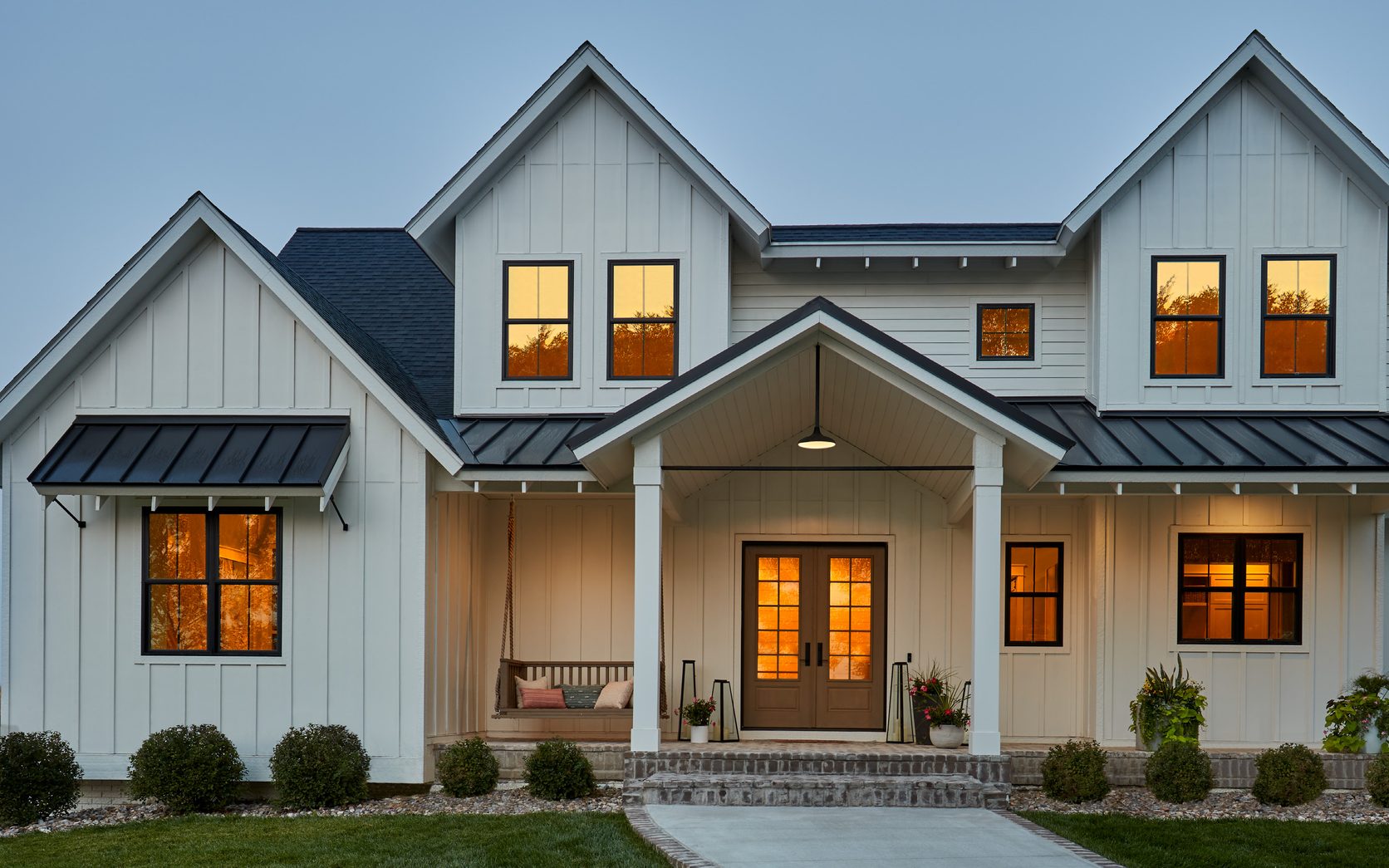 Black-framed Pella windows and double-door entry, the whole-home range from windows to doors that Pella is known for.