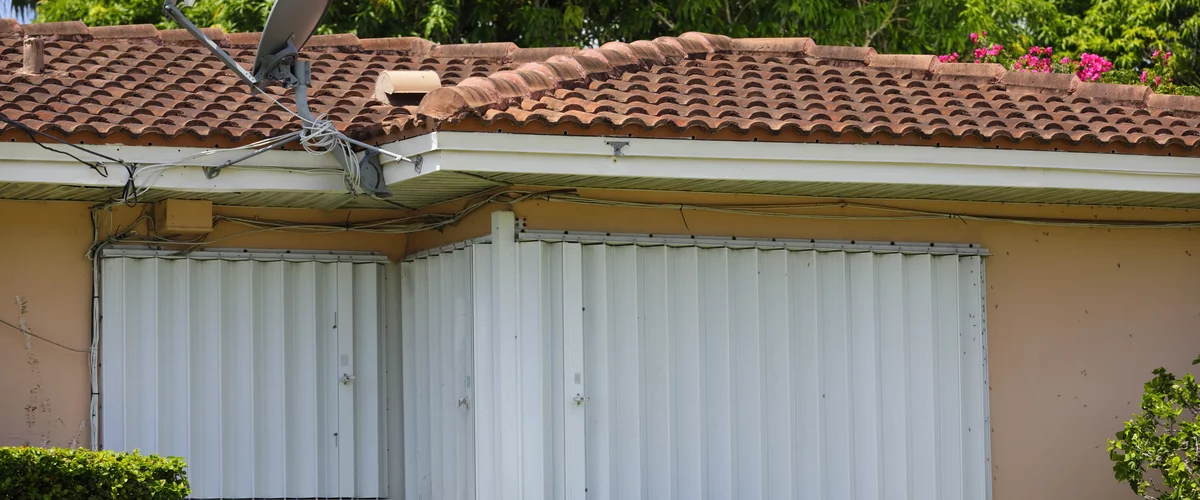 Impact Windows vs Accordion Shutters: The Most Common Hurricane Protection Decision in Florida